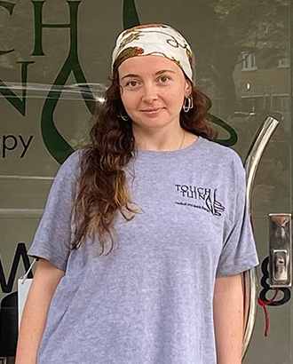 About us - Hazel, Touch Tuina practitioner is pictured outside the Kentish Town clinic