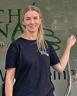 About us - Margo, Touch Tuina practitioner is pictured outside the Kentish Town clinic