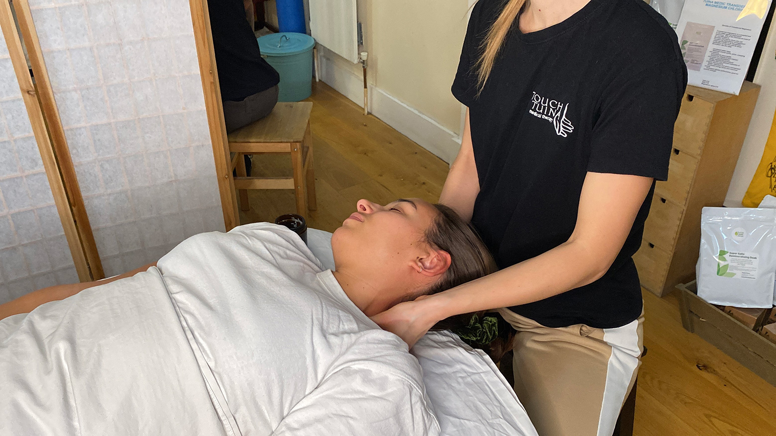 Angelika performs a Touch Tuina neck massage