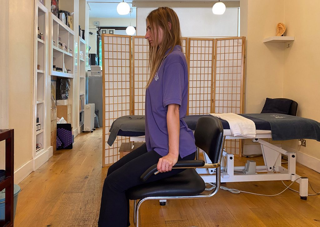 Touch Tuina practitioner Angelika demonstrating The Shoulder Shrug