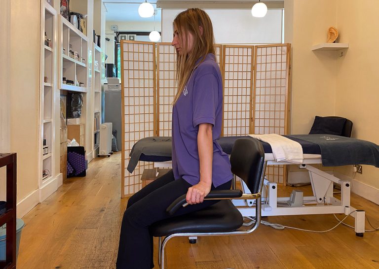 Touch Tuina practitioner Angelika demonstrating The Shoulder Shrug