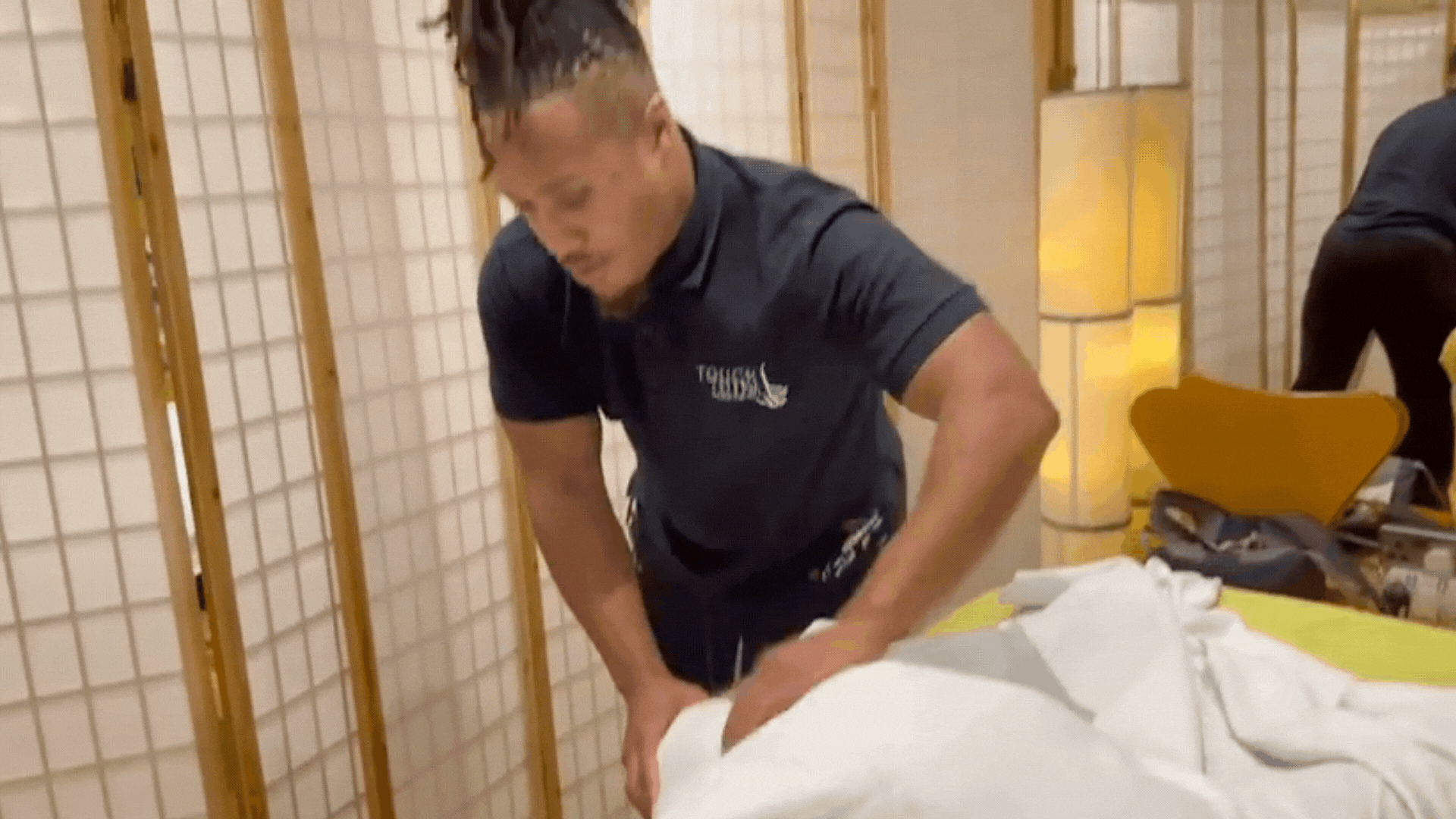 Touch Tuina Practitioner Tyler performing a treatment