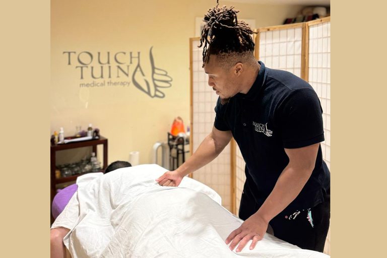 Touch Tuina Practitioner Tyler working at the Kentish Town clinic