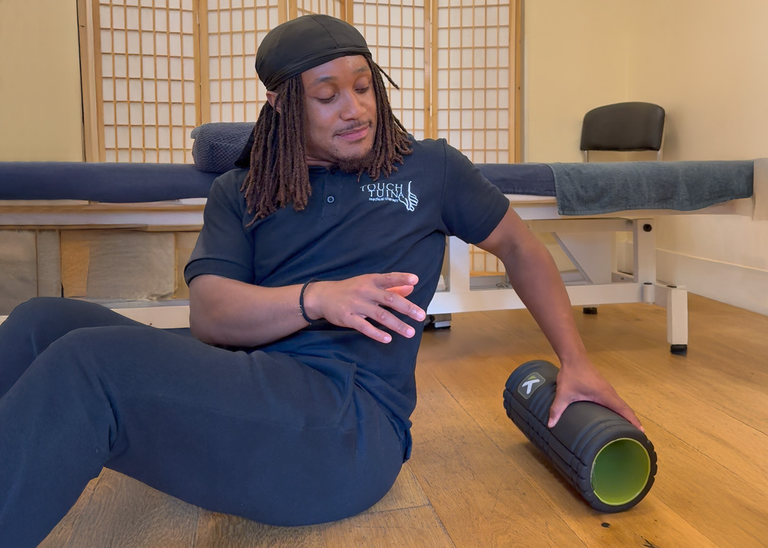 Touch Tjuina practitioner Tyler is about to demonstrate using a foam roller