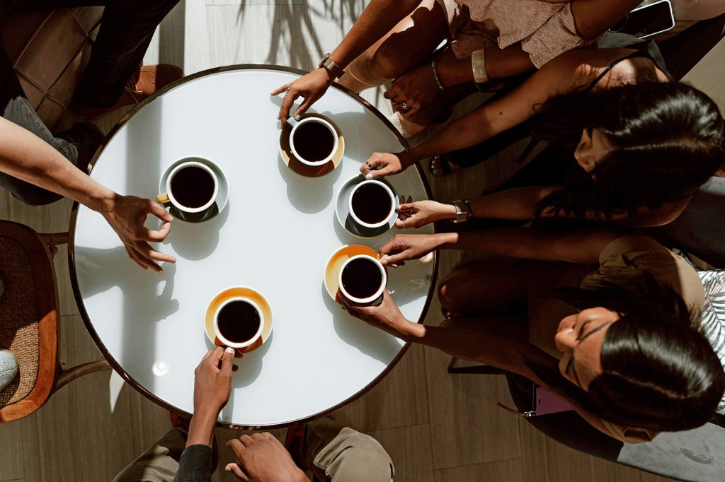 Meeting friends for coffe can help to highlight he Importance of Community